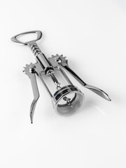 Glossy metal wine bottle opener isolated over the white background