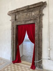 red stage curtains in old castle