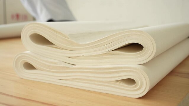 arranging stack of rice paper