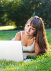 Happy young girl having fun using a computer