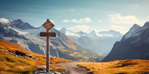 Wooden signpost points the way against a mountain backdrop