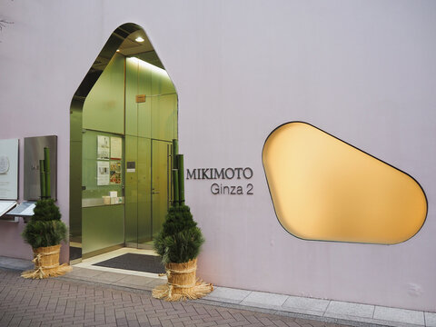 TOKYO, JAPAN - January 6, 2024: An entrance to Mikimoto Ginza 2 store in Tokyo. There are traditional Japanese New Year kadomatsu decorations by the door.