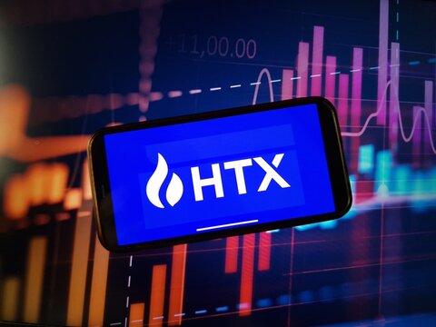 Konskie, Poland - January 05, 2024: HTX cryptocurrency exchange logo displayed on smartphone on crypto market data background
