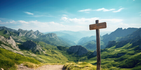 Wooden signpost points the way against a mountain backdrop - obrazy, fototapety, plakaty