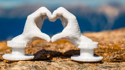 Heart hands gesture with a 3D printed sculpture - free model from thingiverse - at Mount Patscherkofel, Innsbruck, Tyrol, Austria - obrazy, fototapety, plakaty