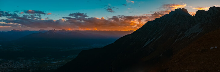 Fototapeta na wymiar High resolution stitched alpine sunset or sundowner summer panorama at the famous Nordkette mountains near Innsbruck, Tyrol, Austria