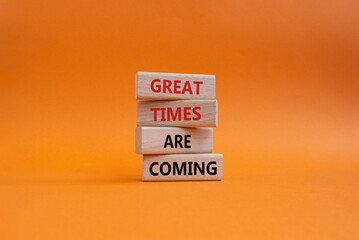 Great times are coming symbol. Concept words Great times are coming on wooden blocks. Beautiful orange background. Business and Great times are coming concept. Copy space.