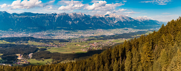 High resolution stitched alpine summer panorama with the city of Innsbruck in the background at...
