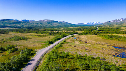 Road leading through breathtaking landscape in Sweden near Handöl
