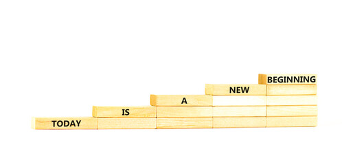 Today is a new beginning symbol. Concept words Today is a new beginning on wooden blocks stairs....