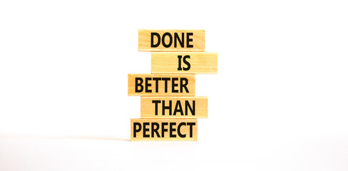 Done is better than perfect symbol. Concept words Done is better than perfect on wooden blocks. Beautiful white table white background. Business, done is better than perfect concept. Copy space.