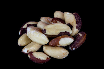 Pile of Shelled Brazil Nuts on a Black Background - 703979886