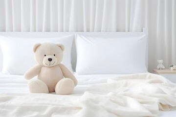 Teddy bear toy on the clean bed