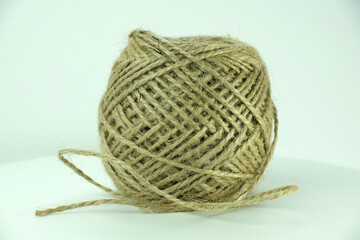 A skein of thread, twine for tying packaging. A ball of twine on a white background.