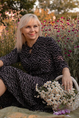 woman holding a basket of flowers