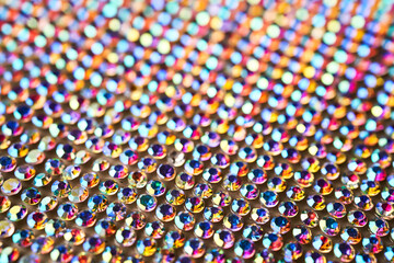 Abstract background made of rhinestones shimmering in the light.