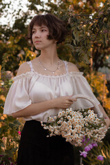 young lady walks in the garden