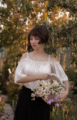 young lady walks in the garden