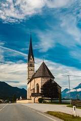 Fototapeta na wymiar Church on a sunny summer day at St Leonhard, Kundl, Kufstein, Tyrol, Austria