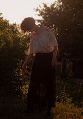 young lady walks in the garden