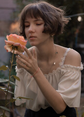 girl smelling flower