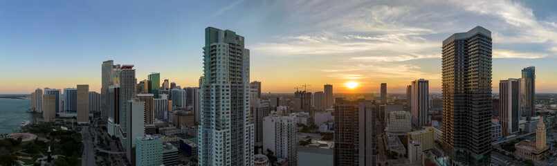 Aerial view of downtown office district of Miami Brickell in Florida, USA at sunset. High commercial and residential skyscraper buildings in modern american megapolis - obrazy, fototapety, plakaty