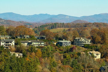 Fototapeta na wymiar Aerial view of expensive american homes on hilltop in North Carolina mountains residential area. New family houses as example of real estate development in USA suburbs