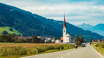 Fototapeten Alpine summer view with a church near Weer, Schwaz, Tyrol, Austria © Martin Erdniss