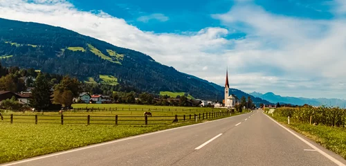 Fototapeten Alpine summer view with a church near Weer, Schwaz, Tyrol, Austria © Martin Erdniss