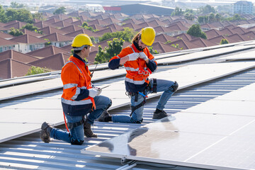 Specialist technician professional engineer checking top view of installing solar roof panel on the...