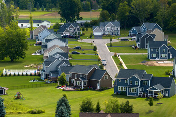 Aerial view of spacious new family houses in upstate New York suburban area. Real estate development in american suburbs