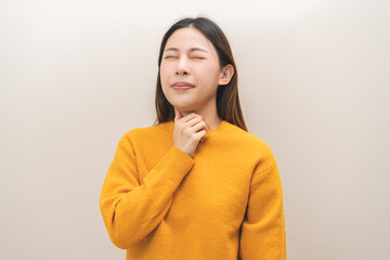 Sickness in inflaming asian young woman, girl use hand check self touch at sore throat, pain...