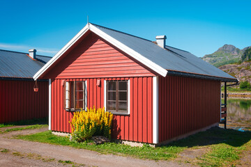 Fototapeta na wymiar Traditional little red Scandinavian Swedish houses, Summer view of a red house Scandinavia Norway, vacation travel concept