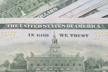 Close up of "In God We Trust" on American hundred dollar bills