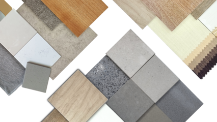 top view of interior material samples board including artificial stones, wooden tiles, concrete vinyl flooring tile, drape catalog, fabric isolated on background with clipping path.