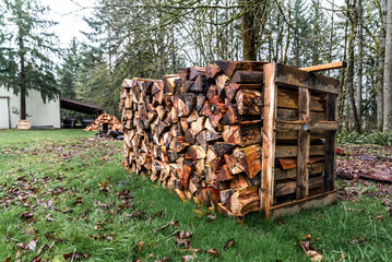 Stack Of Firewood In Front Of Barn