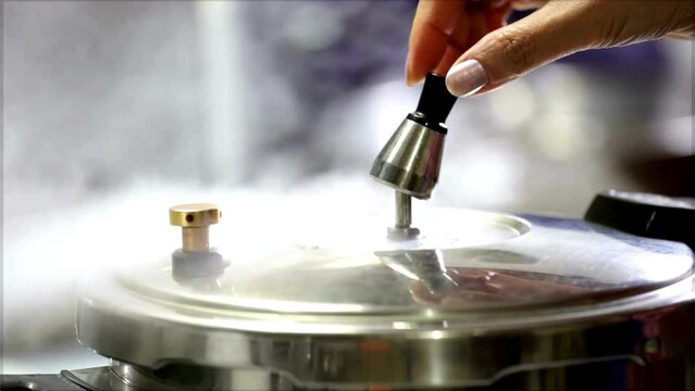 4K Ultra HD Video: Cooking Delight - Pressure Cooker Unleashing Flavors Through Pressure Valve