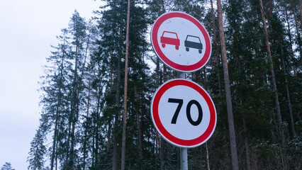 Road signs Restriction of speed 70 and overtaking is prohibited on the winter road