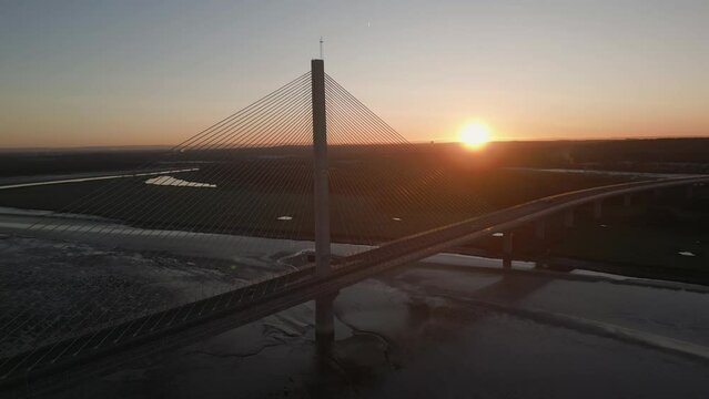 Aerial approach view of The Mersey Gateway Bridge over the Mersey estuary, Runcorn, Cheshire, England