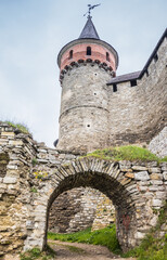The part of Old Kamianets-Podilskyi Castle under a cloudy sky. Powerful bastions and towers of the...