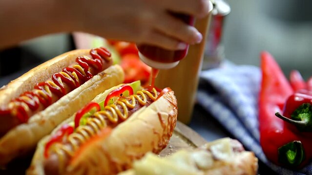 Hot dogs American fast food often served with mustard and ketchup