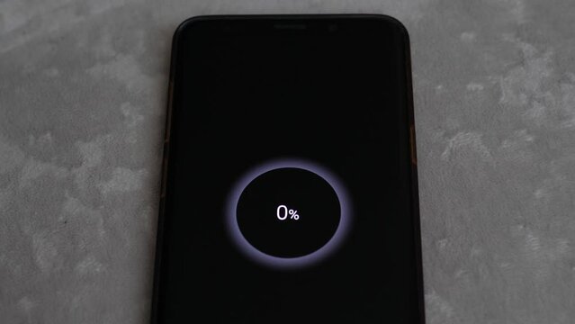 low phone warning on the screen. smartphone with battery level 0 percent. dead smartphone battery