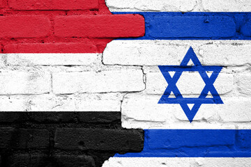 Flags of Yemen and Israel painted on the brick wall