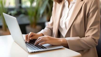Young businesswoman working on laptop,