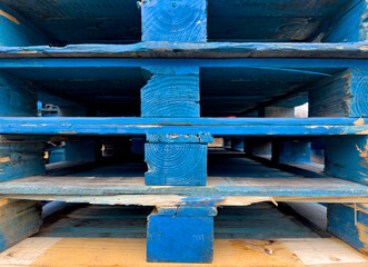 Graphic image of stacked blue wood pallets - 704036654