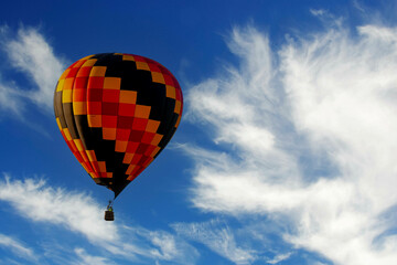 Spectacular Sky Ballet: Dazzling Balloons Paint the Blue Canvas with Joyful Colors