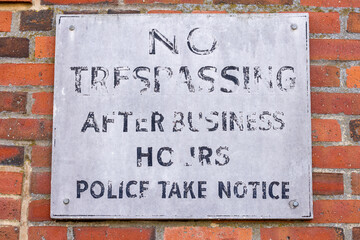 No Trespassing sign after business hours warning