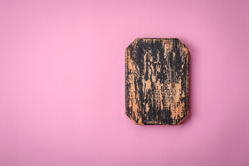 Empty wooden rectangular cutting board on a plain background, flatley with copy space