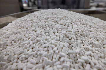 Pile pf pills in pharmaceutical factory