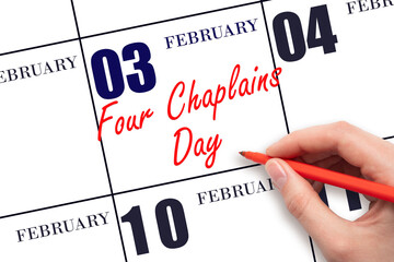 February 3. Hand writing text Four Chaplains Day on calendar date. Save the date.